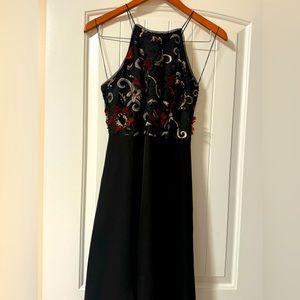 High low dress with pockets. Upper top part has floral stitching designed